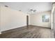 Bright living room with sliding glass door and contemporary gray flooring at 2019 Rutherford Dr, Dover, FL 33527