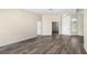 Inviting living room featuring modern gray flooring and neutral walls at 2019 Rutherford Dr, Dover, FL 33527