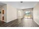 Open-concept living area with stylish flooring and seamless transitions to the backyard at 2019 Rutherford Dr, Dover, FL 33527
