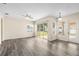 Open living space with large windows and sliding door with backyard views at 2019 Rutherford Dr, Dover, FL 33527