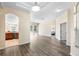 Spacious living area with sleek flooring, recessed lighting, and seamless transitions to other rooms at 2019 Rutherford Dr, Dover, FL 33527