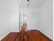 Bright bedroom with hardwood floors, ceiling fan and closet with double doors at 202 S Lincoln Ave, Tampa, FL 33609