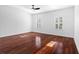Inviting bedroom with hard floors, natural light, and a ceiling fan at 202 S Lincoln Ave, Tampa, FL 33609