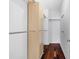 Walk-in closet with hard floors, hanging rods and additional storage cabinet at 202 S Lincoln Ave, Tampa, FL 33609