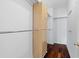 Walk-in closet with built-in storage and hardwood floors at 202 S Lincoln Ave, Tampa, FL 33609