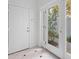 Bright entryway with white doors, tiled flooring, and view to the front at 202 S Lincoln Ave, Tampa, FL 33609