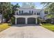 Charming townhome with a two-car garage and well-maintained landscaping at 202 S Lincoln Ave, Tampa, FL 33609