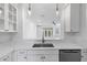 Kitchen with quartz counters and stainless steel sink and faucet at 202 S Lincoln Ave, Tampa, FL 33609