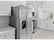 Bright kitchen with stainless steel refrigerator and modern appliances at 202 S Lincoln Ave, Tampa, FL 33609