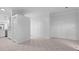Bright, open-concept living space with modern tile flooring and white walls at 202 S Lincoln Ave, Tampa, FL 33609