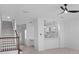 Open-concept living area featuring updated stairway and kitchen at 202 S Lincoln Ave, Tampa, FL 33609