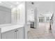 Bright living room with tile floor leading to the kitchen and staircase at 202 S Lincoln Ave, Tampa, FL 33609