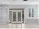 Patio with french doors leading to a bright living room at 202 S Lincoln Ave, Tampa, FL 33609