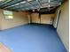 Spacious basement with smooth flooring, ready for customization and storage, featuring a window and water heater at 2172 University S Dr, Clearwater, FL 33764