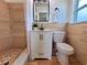 Bathroom features a stylish vanity, stone tiled shower floor, and modern fixtures at 2172 University S Dr, Clearwater, FL 33764