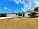 Inviting single-story home with a well-maintained lawn, attached garage, and classic design elements at 2172 University S Dr, Clearwater, FL 33764