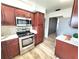 Bright kitchen with stainless steel appliances, wooden cabinets and plenty of counter space at 2172 University S Dr, Clearwater, FL 33764