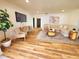 Cozy living room featuring a comfortable sofa, hardwood floors, a TV, and stylish decor at 2172 University S Dr, Clearwater, FL 33764