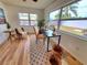 Well lit office boasting wood look floors, backyard views and a stylish patterned rug at 2172 University S Dr, Clearwater, FL 33764
