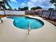 Beautiful pool surrounded by a spacious patio, perfect for outdoor entertaining at 2172 University S Dr, Clearwater, FL 33764