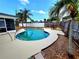 Beautiful kidney-shaped pool set in a landscaped backyard at 2172 University S Dr, Clearwater, FL 33764