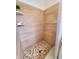 Shower features stone flooring and neutral toned tile at 2172 University S Dr, Clearwater, FL 33764