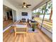 Relaxing sunroom featuring outdoor patio furniture at 2172 University S Dr, Clearwater, FL 33764
