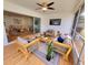 Bright sunroom with patio seating, and a view of the landscaped yard and pool at 2172 University S Dr, Clearwater, FL 33764