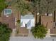An aerial shows the layout of the home and its proximity to neighbors, showcasing the roof and yard space at 2336 Windsor Oaks Ave, Lutz, FL 33549