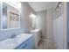 Bathroom features updated fixtures, including double sinks and a shower and bath combo at 2336 Windsor Oaks Ave, Lutz, FL 33549