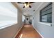 Cozy bonus room with hardwood floors and ceiling fans for added comfort at 2336 Windsor Oaks Ave, Lutz, FL 33549