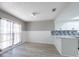 Modern eat-in kitchen with stainless steel appliances, breakfast bar, and lots of natural light at 2336 Windsor Oaks Ave, Lutz, FL 33549