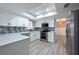 Bright, renovated kitchen with stainless appliances, quartz countertops and updated cabinets at 2336 Windsor Oaks Ave, Lutz, FL 33549
