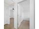 Hallway views into the bedrooms featuring neutral walls and ceiling fans at 2350 38Th N Ave, St Petersburg, FL 33713