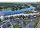 Aerial view of waterfront condo community, with private docks, boat slips, covered parking, and city views at 2424 W Tampa Bay Blvd # I202, Tampa, FL 33607