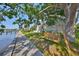 Relaxing backyard with views of the water and a swing under a shady tree at 2424 W Tampa Bay Blvd # I202, Tampa, FL 33607