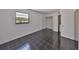 Spacious bedroom featuring black tile flooring, ample light, and washer/dryer in closet at 2424 W Tampa Bay Blvd # I202, Tampa, FL 33607