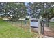 Community dog park with mature trees and green grass for residents and their pets at 2424 W Tampa Bay Blvd # I202, Tampa, FL 33607
