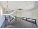 Spacious living room with sleek black tile floors and a ceiling fan at 2424 W Tampa Bay Blvd # I202, Tampa, FL 33607