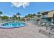Community pool with surrounding lounge chairs at 2424 W Tampa Bay Blvd # I202, Tampa, FL 33607