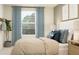 Cozy bedroom with a serene view from the window, complementing the calming decor at 2681 Buttercup Lucine Ln, Ruskin, FL 33570