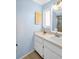 Bathroom featuring single sink vanity, with a window with natural light at 2967 Macalpin N Dr, Palm Harbor, FL 34684