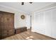 Bedroom featuring plank flooring, an armoire, and built-in closets at 2967 Macalpin N Dr, Palm Harbor, FL 34684