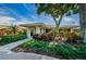 Well-landscaped entrance to a building, with manicured bushes and brick accents at 2967 Macalpin N Dr, Palm Harbor, FL 34684