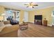 Comfortable living room with modern TV and hardwood floors for a cozy atmosphere at 2967 Macalpin N Dr, Palm Harbor, FL 34684