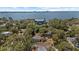 Aerial shot showcasing a property surrounded by trees with a bay view at 3025 50Th St S S St, Gulfport, FL 33707
