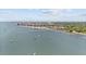 Nice aerial view of a pier and sailboats in a calm bay with buildings and trees at 3025 50Th St S S St, Gulfport, FL 33707