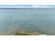 Expansive aerial view of open water dotted with sailboats under a blue sky with clouds at 3025 50Th St S S St, Gulfport, FL 33707