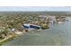 Expansive aerial of boat house and dock area surrounded by trees and other buildings at 3025 50Th St S S St, Gulfport, FL 33707
