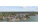 Charming aerial view of marina with boats docked near houses with lush trees at 3025 50Th St S S St, Gulfport, FL 33707